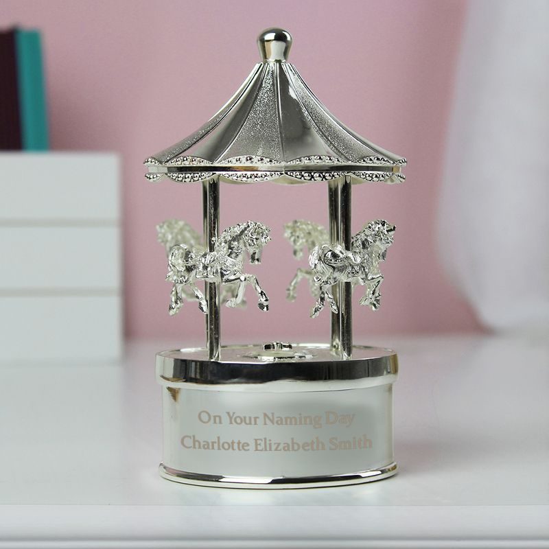 Personalised silver-plated musical carousel ornament engraved On Your Naming Day with the child's name